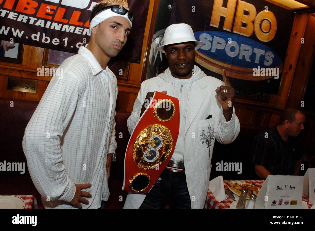 Jun 13, 2007 - Manhattan, NY, USA - Challenger PAULIE MALIGNAGGI (L) and title holder LOVEMORE N'DOU (R), holding the championship belt, pose for a photograph. Gallagher's Steakhouse hosts a press conference promoting the IBF Junior Welterweight Championship bout as Paulie Maliginaggi, of Bensonhurst Brooklyn challenges veteran world titlist Lovemore N'dou this Saturday night, June Stock Photo