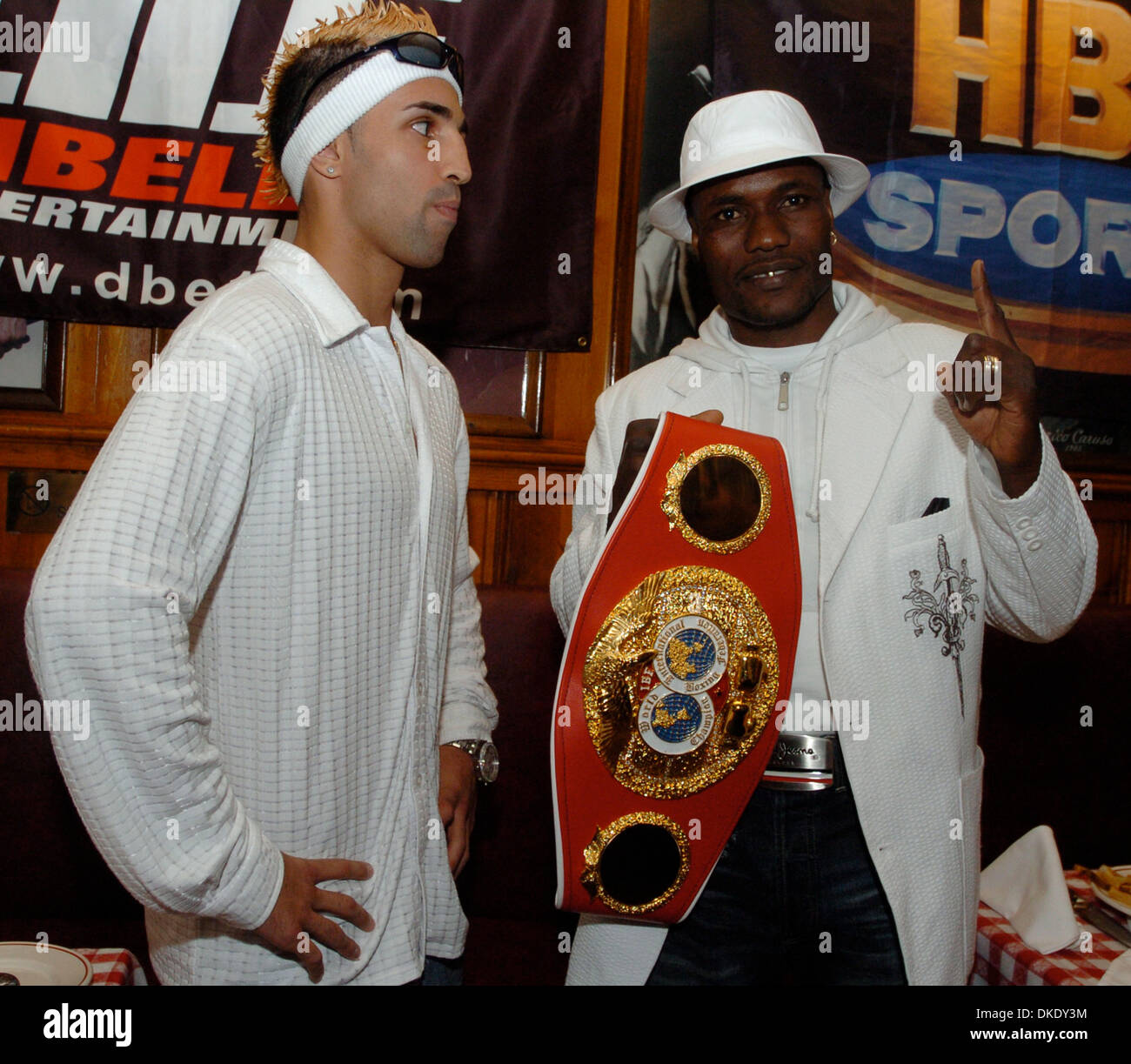 Jun 13, 2007 - Manhattan, NY, USA - Challenger PAULIE MALIGNAGGI (L) and title holder LOVEMORE N'DOU (R), holding the championship belt, pose for a photograph. Gallagher's Steakhouse hosts a press conference promoting the IBF Junior Welterweight Championship bout as Paulie Maliginaggi, of Bensonhurst Brooklyn challenges veteran world titlist Lovemore N'dou this Saturday night, June Stock Photo