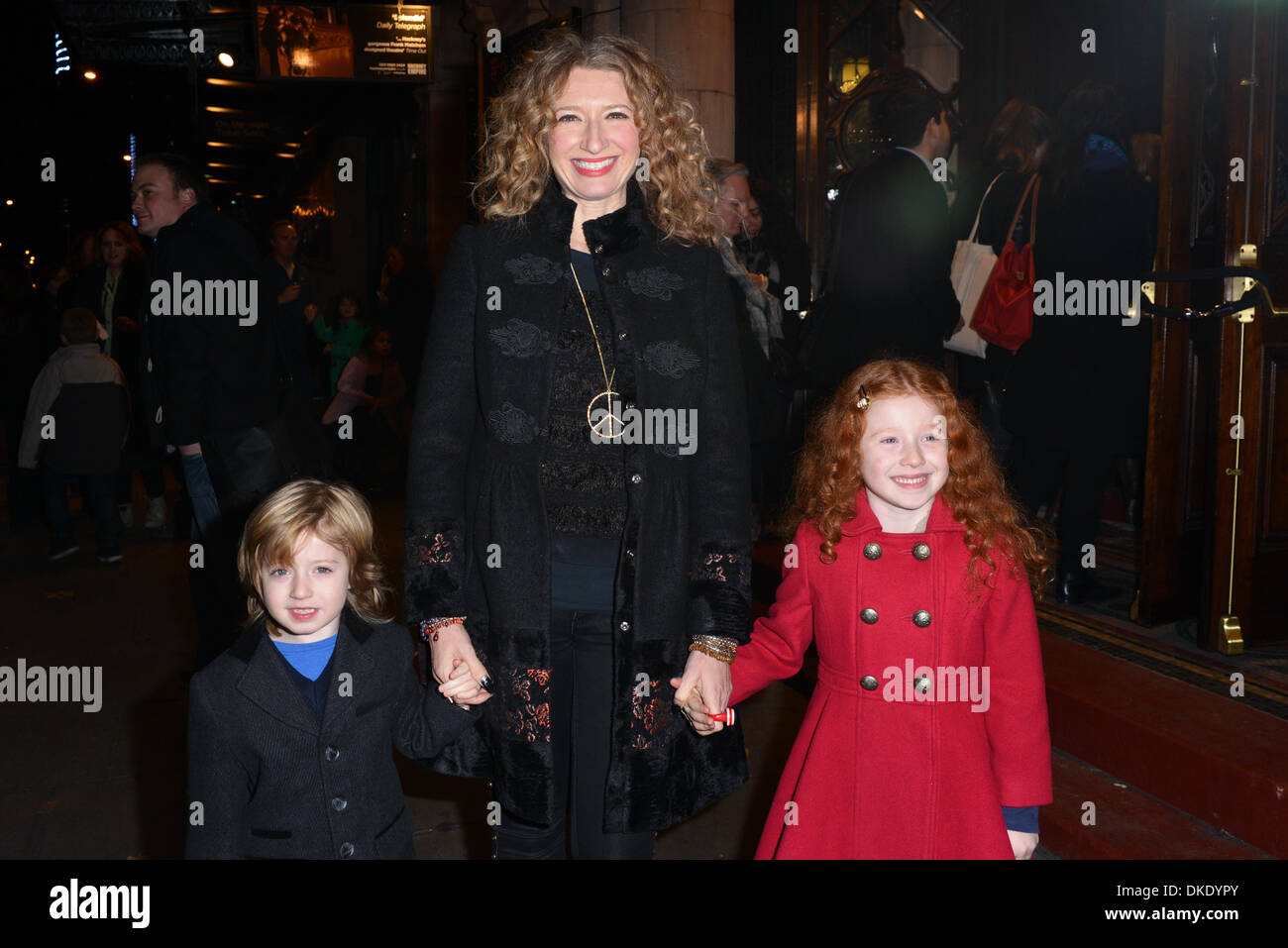 London, UK. 4th December 2013. Melanie Masson and her kids arrive at