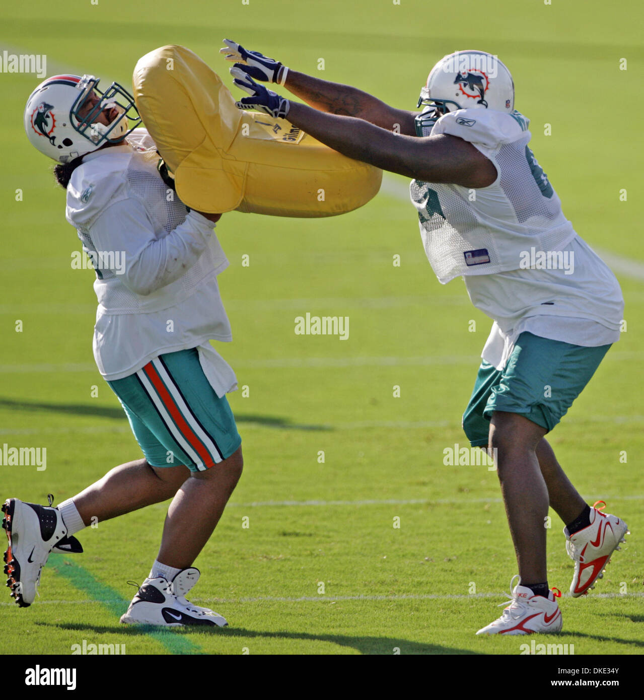 Jul 28, 2007 - Davie, FL, USA - Dolphins linemen SAMSON SATELE (left) and JULIUS WILSON take part in a drill on the first day of traininng camp. (Credit Image: © Allen Eyestone/Palm Beach Post/ZUMA Press) RESTRICTIONS: USA Tabloid RIGHTS OUT! Stock Photo
