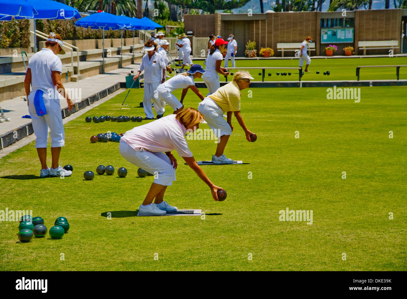 Jul 30, 2007 - Laguna Beach, CA, USA - Two female players prepare to roll an asymmetrical 'bowl' (ball) during a lawn bowling competition on a bowling green in Laguna Beach, CA.The object of the game is to roll bowls as close to a previously-rolled 'jack' ball as possible without touching it. (Credit Image: © Spencer Grant/ZUMA Press) Stock Photo