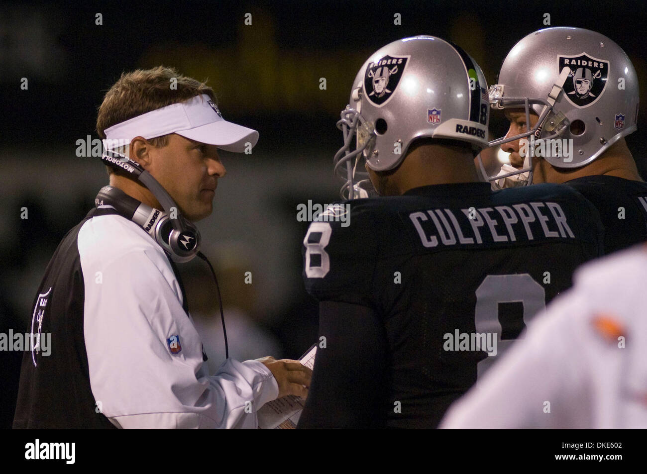 Aug 13, 2007 - OAKLAND, CA, USA - Oakland Raiders head coach LANE KIFFIN gives instructions to DAUNTE CULPEPPER and JEREMY NEWBERRY during the pre-season game against the Arizona Cardinals at McAfee Coliseum. (Credit Image: © Al Golub/ZUMApress.com) Stock Photo