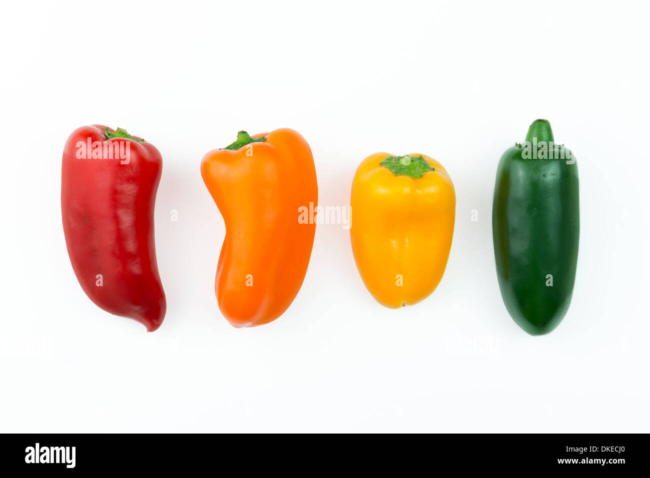 Red, orange, yellow and green jalapeno pepper in a row Stock Photo Alamy