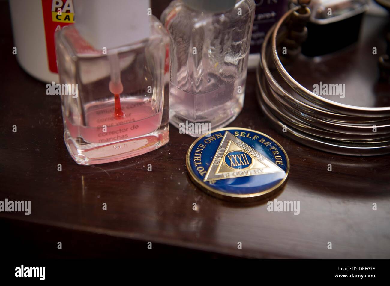 East Point, Georgia, USA. 4th Dec, 2013. Stephenie Vieweigh's Alcoholics Anonymous medallion honoring her 32 years rests prominently on her dresser. © Robin Nelson/ZUMA Wire/ZUMAPRESS.com/Alamy Live News Stock Photo