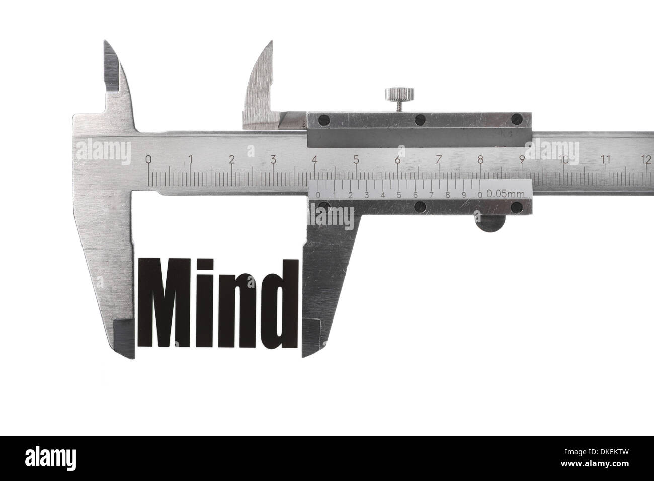 Two hands holding a caliper, measuring the word "Mind Stock Photo Alamy