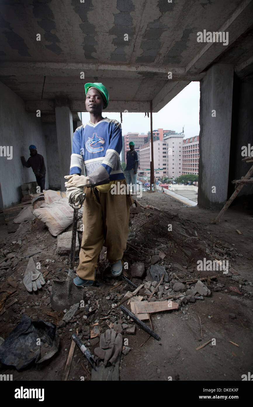 Construction workers on a high rise building site, Nairobi, Kenya Stock