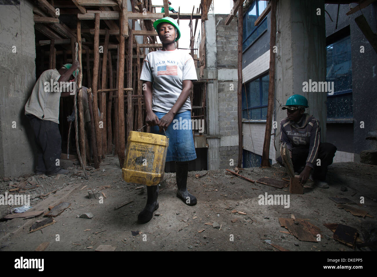 Female construction worker on a high rise building site, Nairobi, Kenya Stock Photo