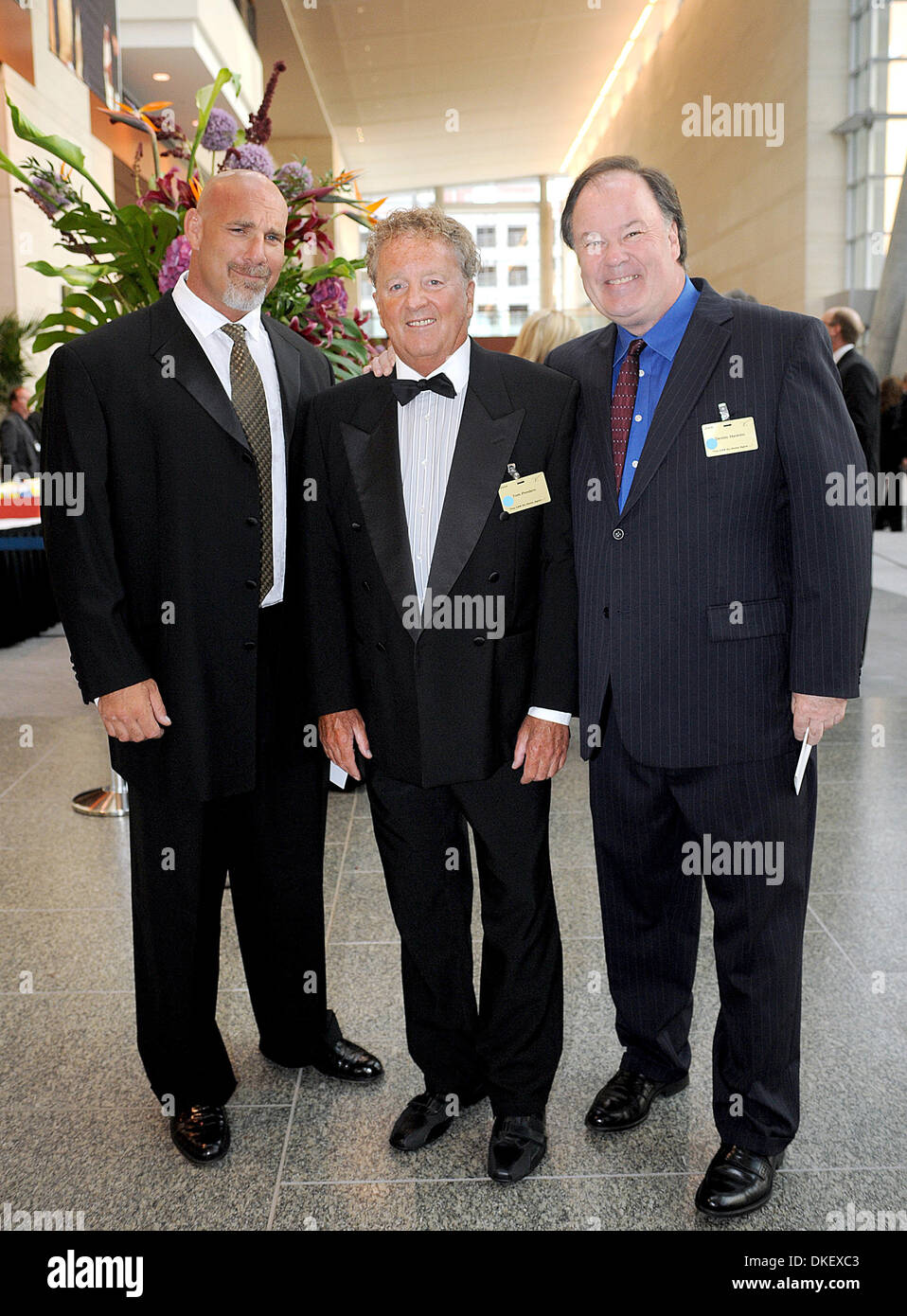 Aug 15, 2009; Raleigh, North Carolina, USA; (L-R) Wrestler BILL GOLDBERG, Univerity of Houston CoachTOM PENDERS and Actor DENNIS HASKINS arrive at the Jimmy V Gala to help kick off the Celebrity Golf Classic.  The Black Tie Gala took place at the Raleigh Convention Center. The Jimmy Valvano Foundation has raised over 12 million dollars to help benefit cancer research. Coach Jim Val Stock Photo