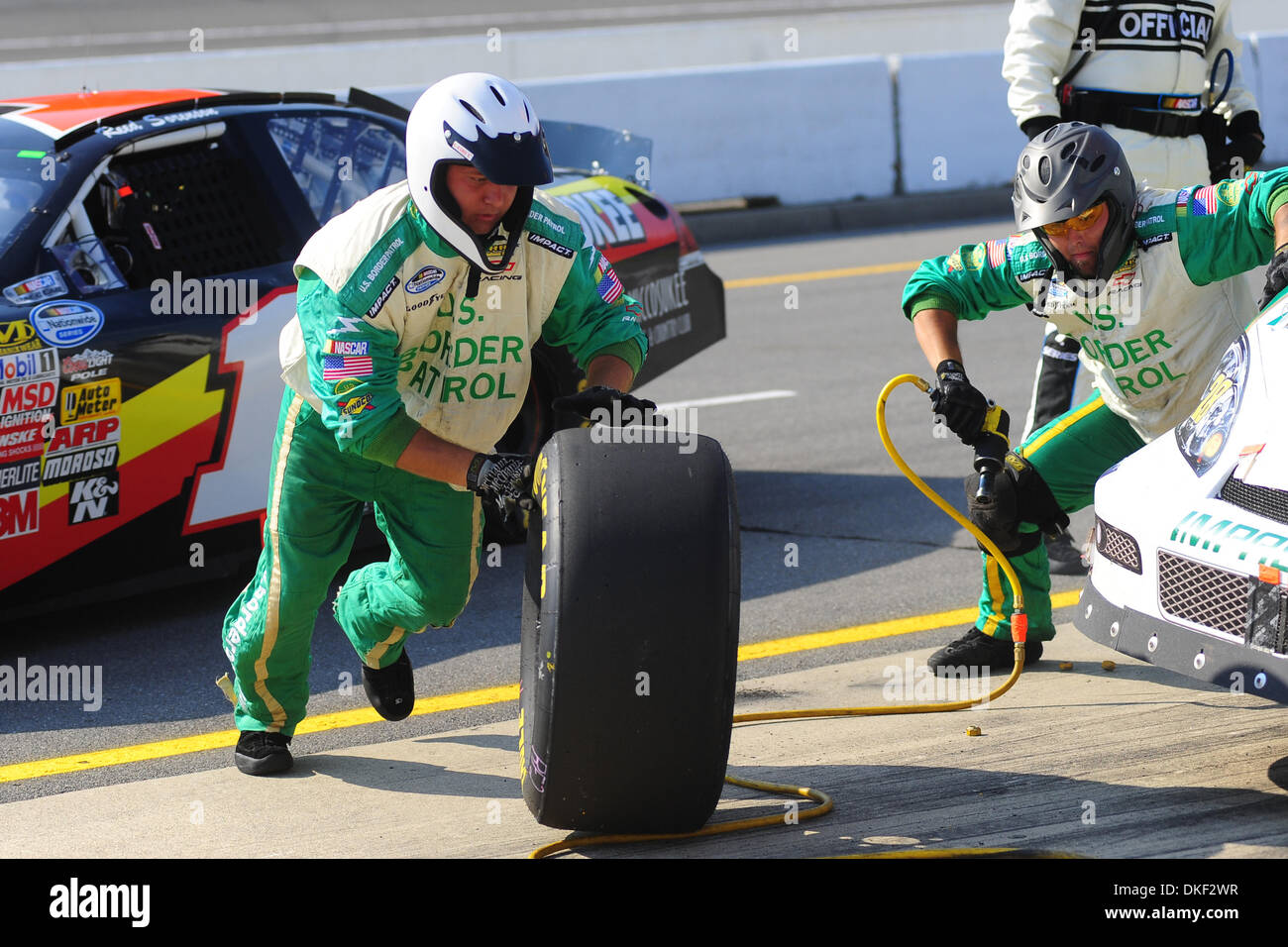 15 August 2009: Kenny Wallace's front tire carrier bring the old tire back to the wall in the US Border Patrol Chevrolet's final stop during Saturday's NASCAR Nationwide Series CarFax 250 at Michigan International Speedway in Brooklyn, Michigan. (Credit Image: © Southcreek Global/ZUMApress.com) Stock Photo