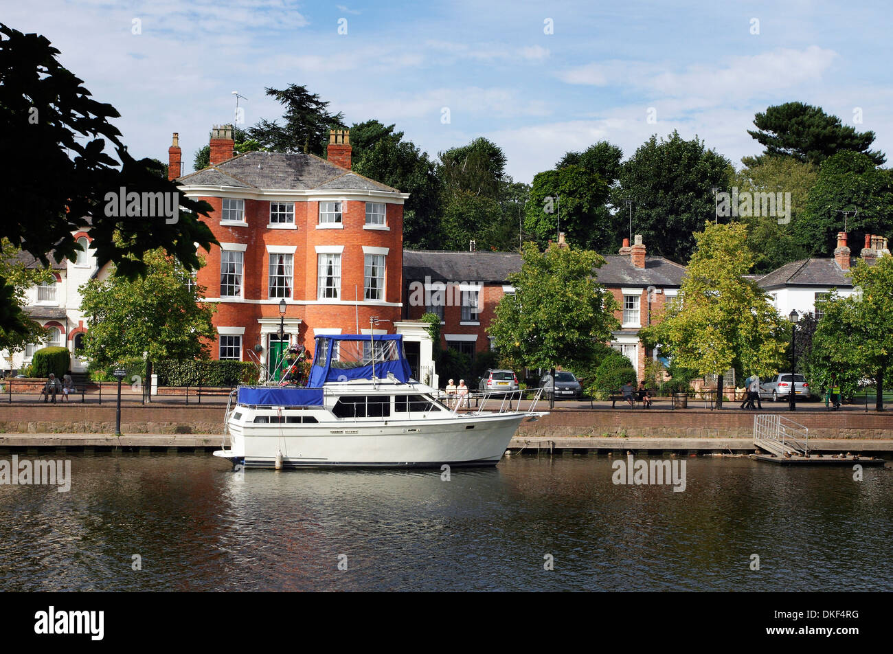 The River Dee at Chester, showing private boats moored at riverside moorings, and riverside houses. Stock Photo
