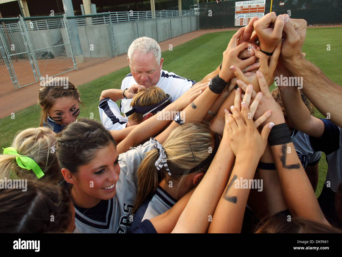 FOR SPORTS - Smithson Valley's headcoach Wayne Daigle (center left) huddles with the team prior to the Class 4A state semifinal game with Plano East Friday June 5, 2009 at Red and Charline McCombs Field in Austin, Tx. (Credit Image: © San Antonio Express-News/ZUMA Press) Stock Photo