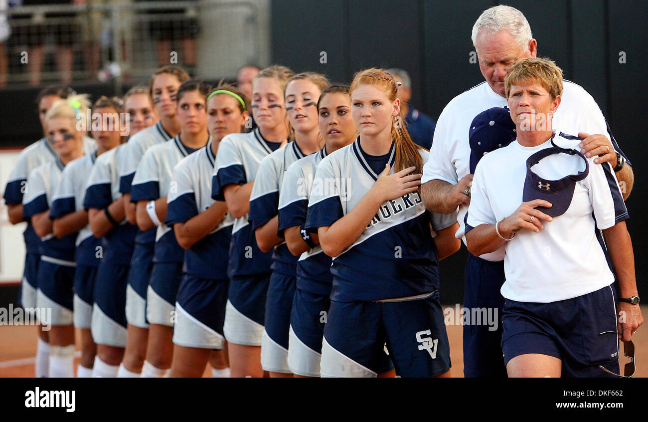 FOR SPORTS - Smithson Valley's headcoach Wayne Daigle and assistant coach Lisa Daigle stand with the team during the national anthem prior to the Class 4A state semifinal game with Plano East Friday June 5, 2009 at Red and Charline McCombs Field in Austin, Tx. (Credit Image: © San Antonio Express-News/ZUMA Press) Stock Photo