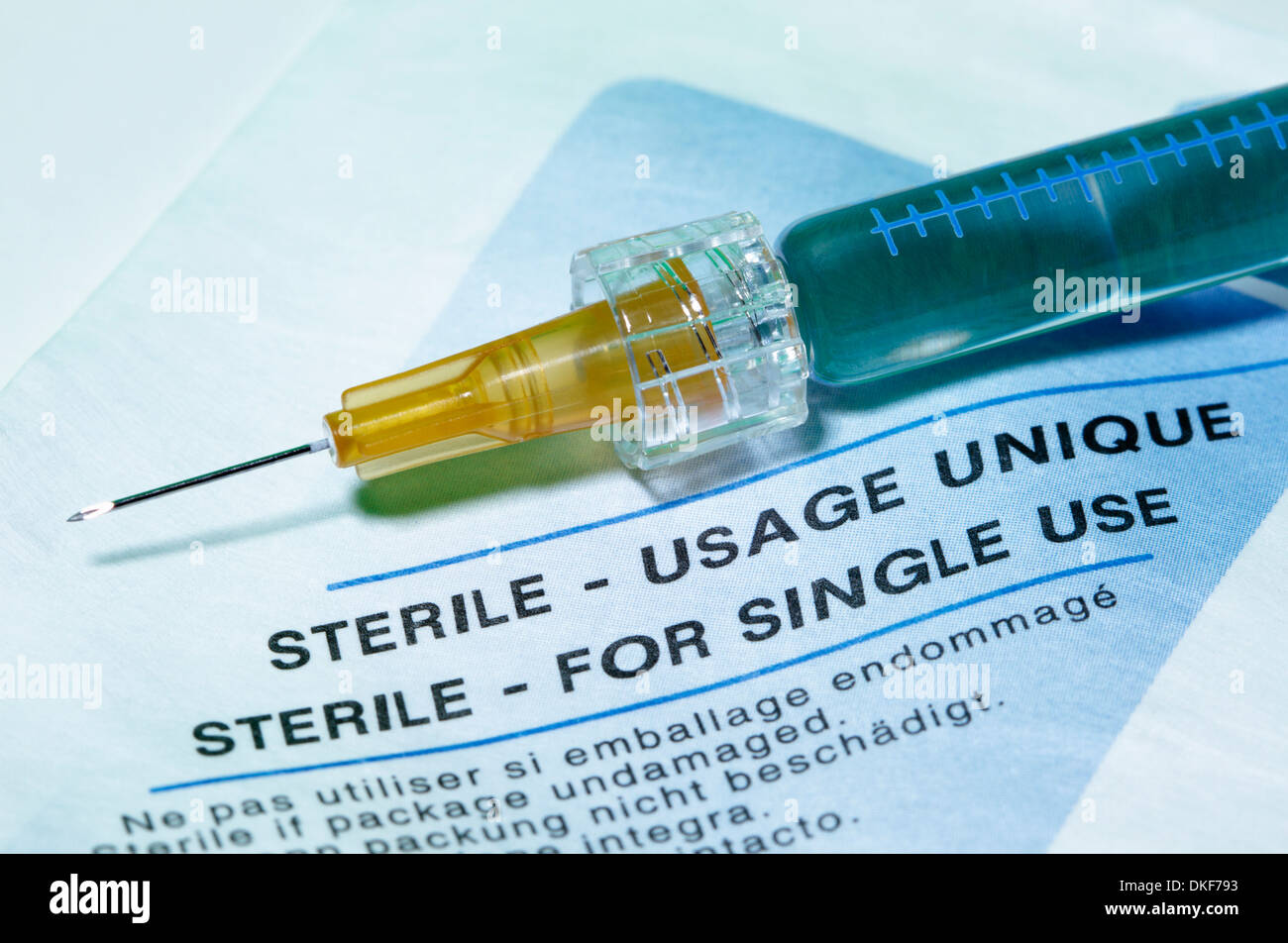 Disposable plastic medical syringe with a hypodermic needle Stock Photo