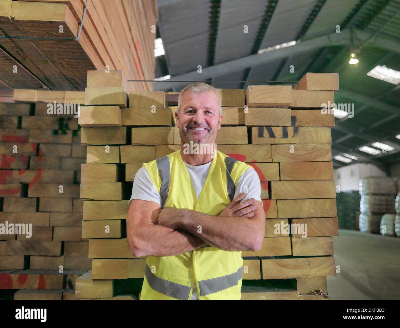 Portrait of worker standing in port store, smiling Stock Photo