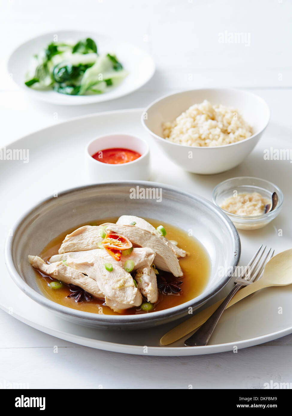 Still life of hainan chicken with steamed rice Stock Photo