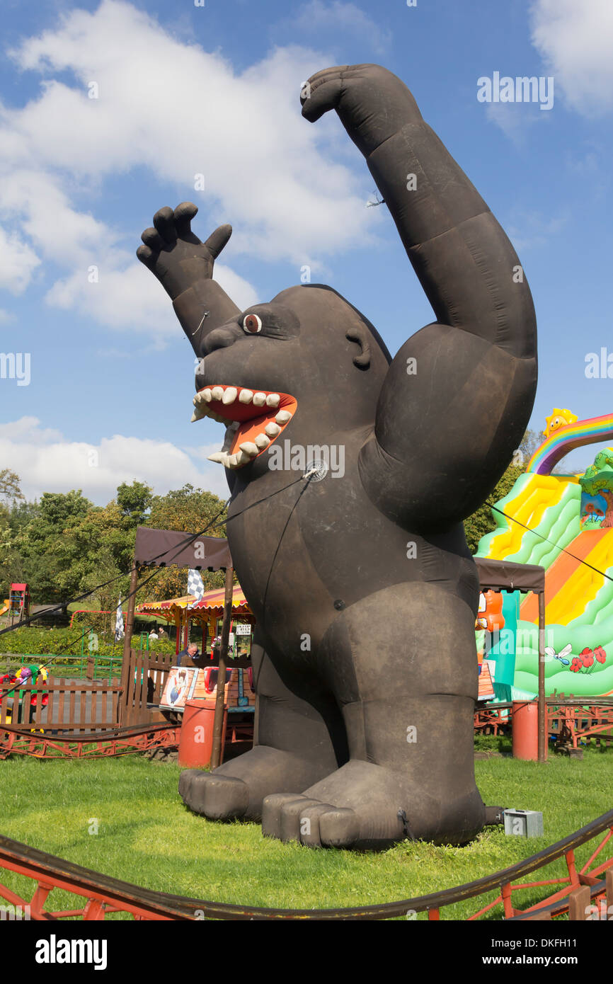large inflatable 'King Kong' gorilla, a scenic addition to a rollercoaster  ride for small children at Moss Bank park, Bolton Stock Photo - Alamy