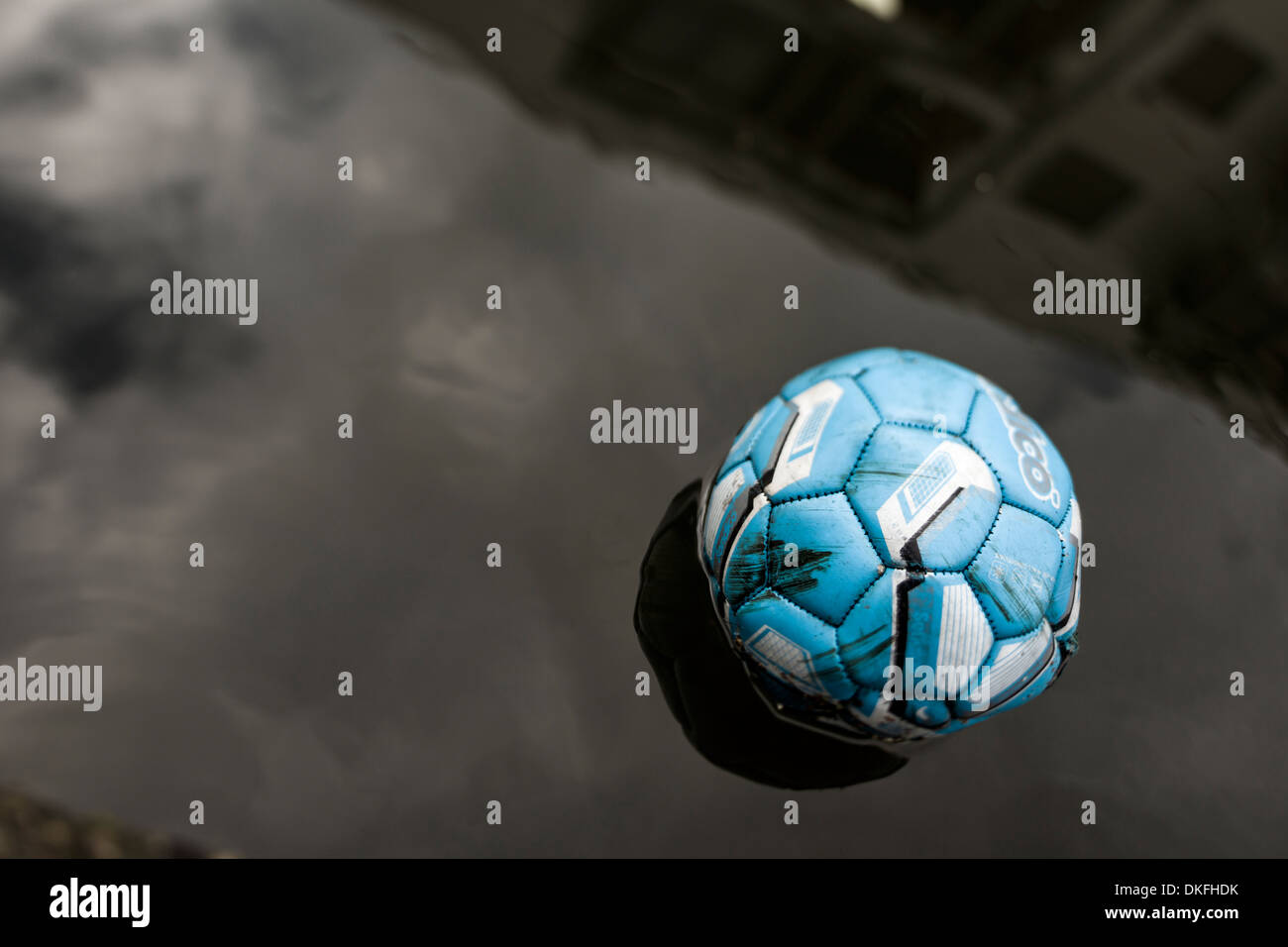 An Old Long Forgotten Weather Beaten Football Drifts Serenely Down The Regents Canal Near 