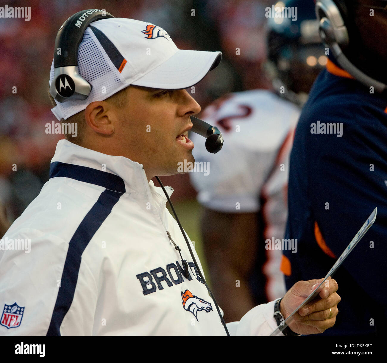 Denver Broncos head coach Josh McDaniels (R) congratulates running back  LenDale White (26) after his two-yard touchdown run against the Pittsburgh  Steelers during the first quarter at Invesco Field at Mile High