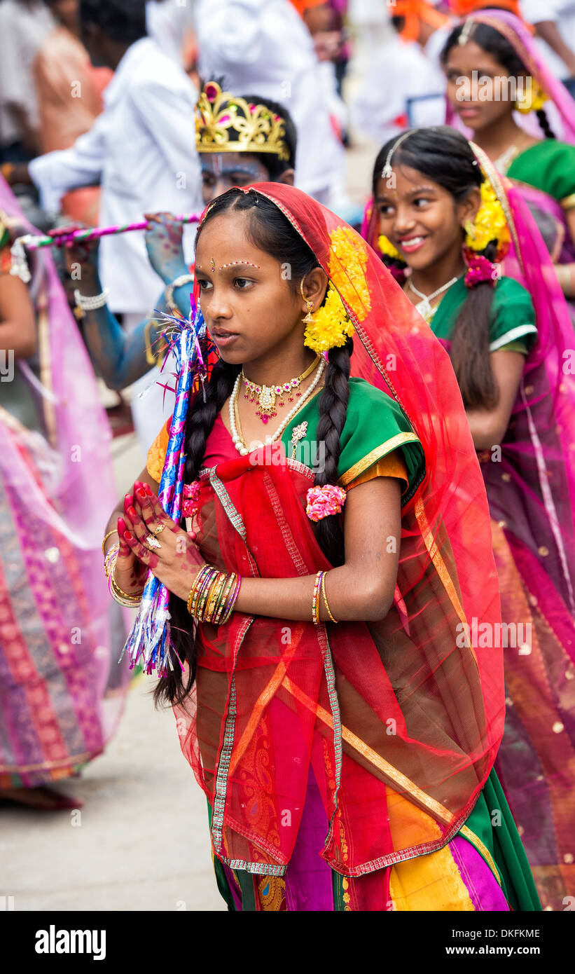 Indian girls in traditional dress dancing at a festival in the streets of Puttaparthi. Andhra Pradesh, India Stock Photo