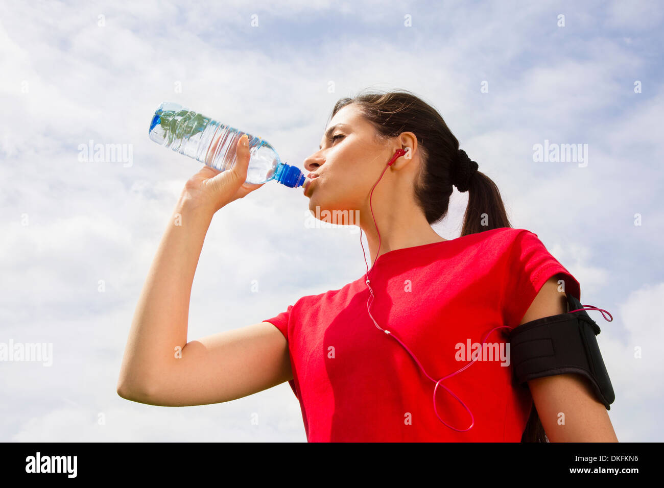 Jogger having drink of water Stock Photo