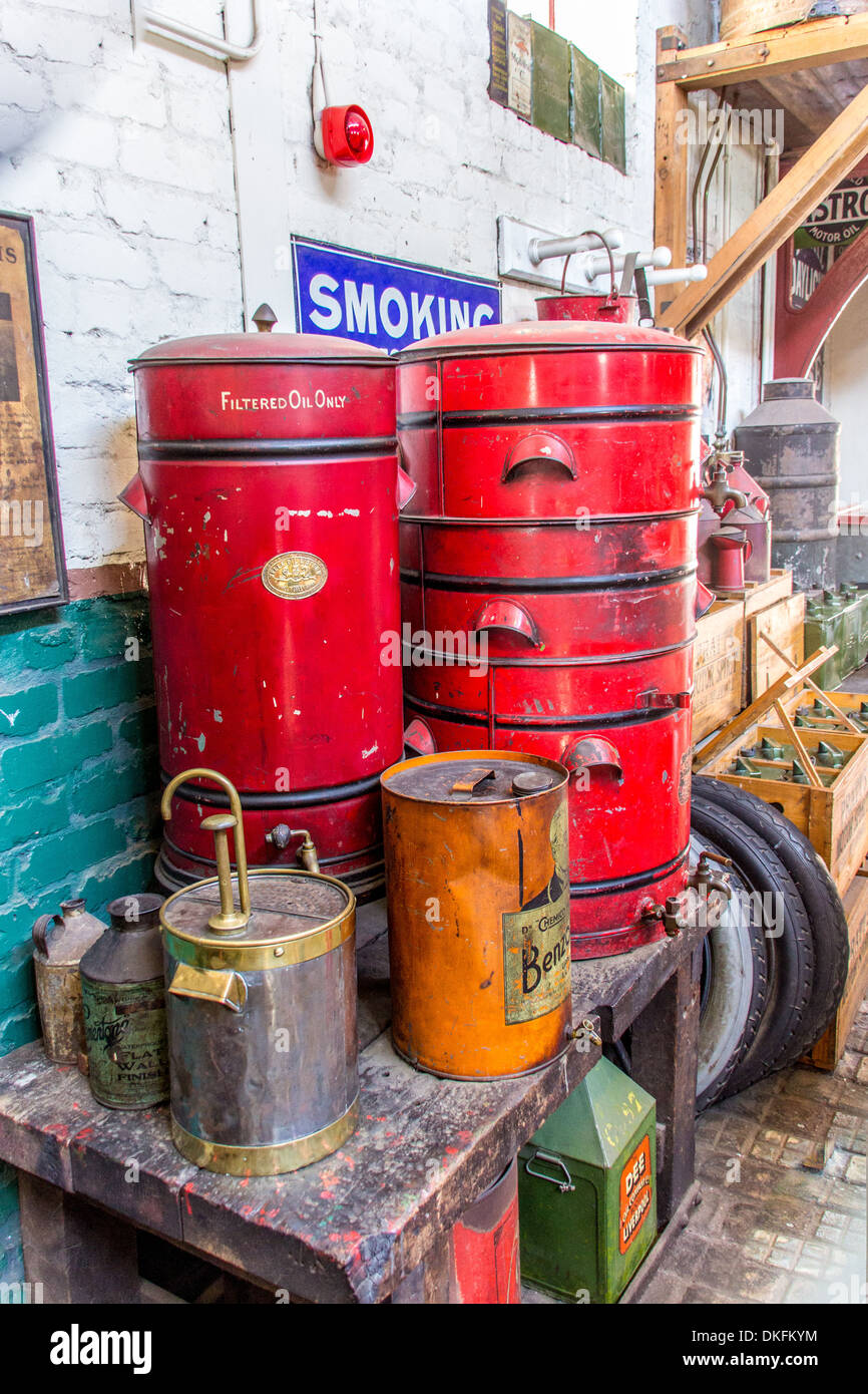 Fuel tanks in a with small oil drums on a table, smoking sign