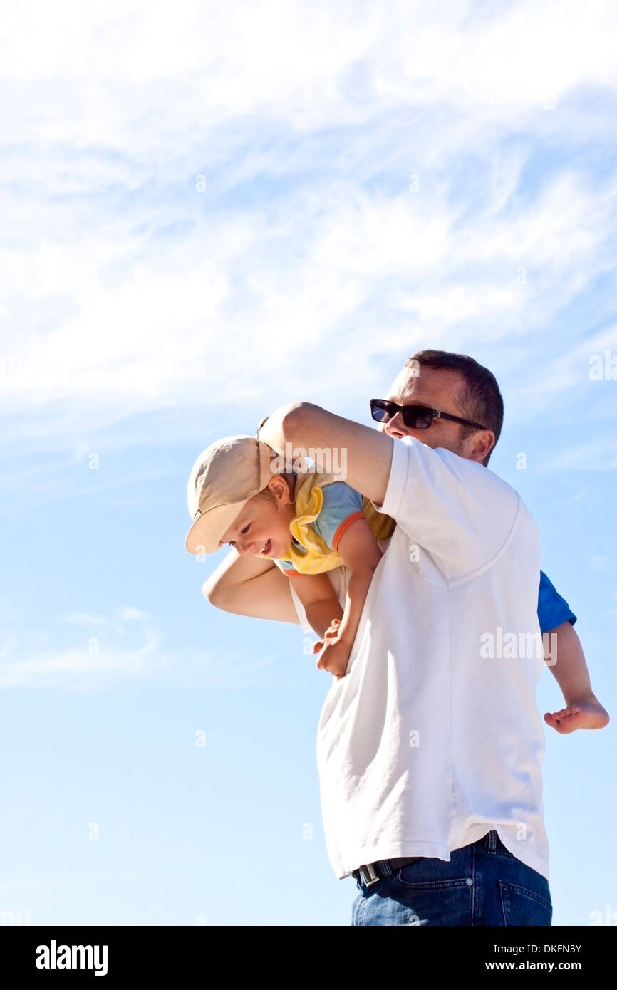 Father romping with his daughter Stock Photo
