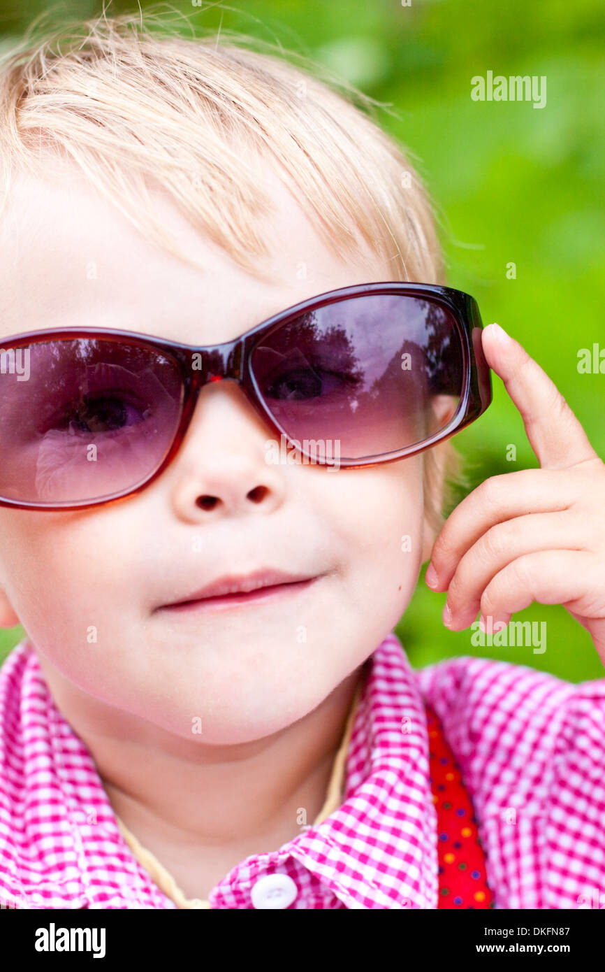 Little girl wearing sunglasses Stock Photo Alamy