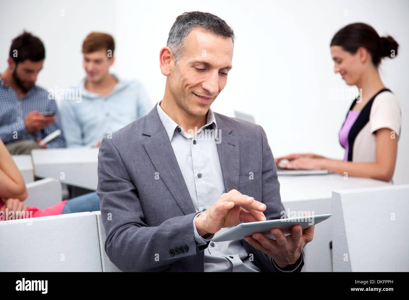 Mature man using digital tablet Stock Photo