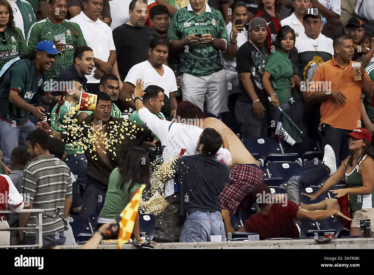 Jul 10, 2009 - Houston, Texas, USA - Fans fight in the stands late in the second half, reflecting an increasingly physical on-field game.  Panama and Mexico tied 1-1 at Reliant Stadium. (Credit Image: © Diana Porter/Southcreek Global/ZUMA Press) Stock Photo