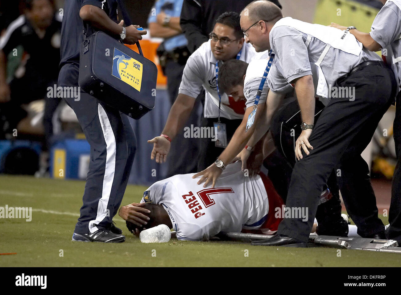 Jul 10, 2009 - Houston, Texas, USA - While being carried off the field, BLAS PEREZ (#7) of Panama is by an bottle thrown at him from the stands.  Panama and Mexico tied 1-1 at Reliant Stadium. (Credit Image: © Diana Porter/Southcreek Global/ZUMA Press) Stock Photo