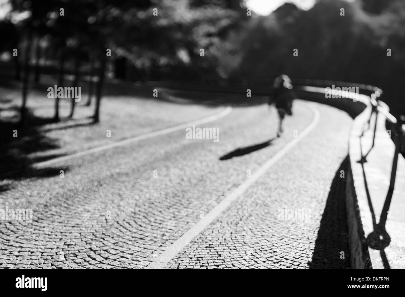 Woman walks through road hi-res stock photography and images - Alamy