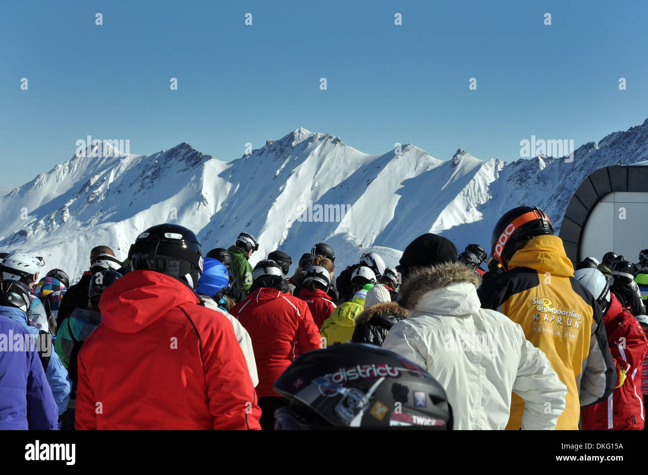 Crowds wait in the chair-lift queue Zell am See, Austria Stock Photo