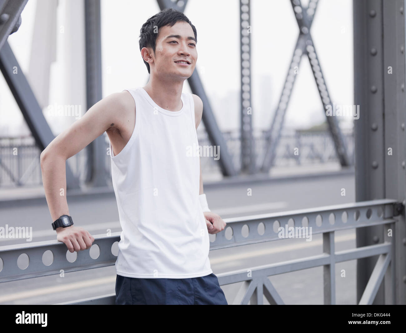 Jogger on a bridge Stock Photo