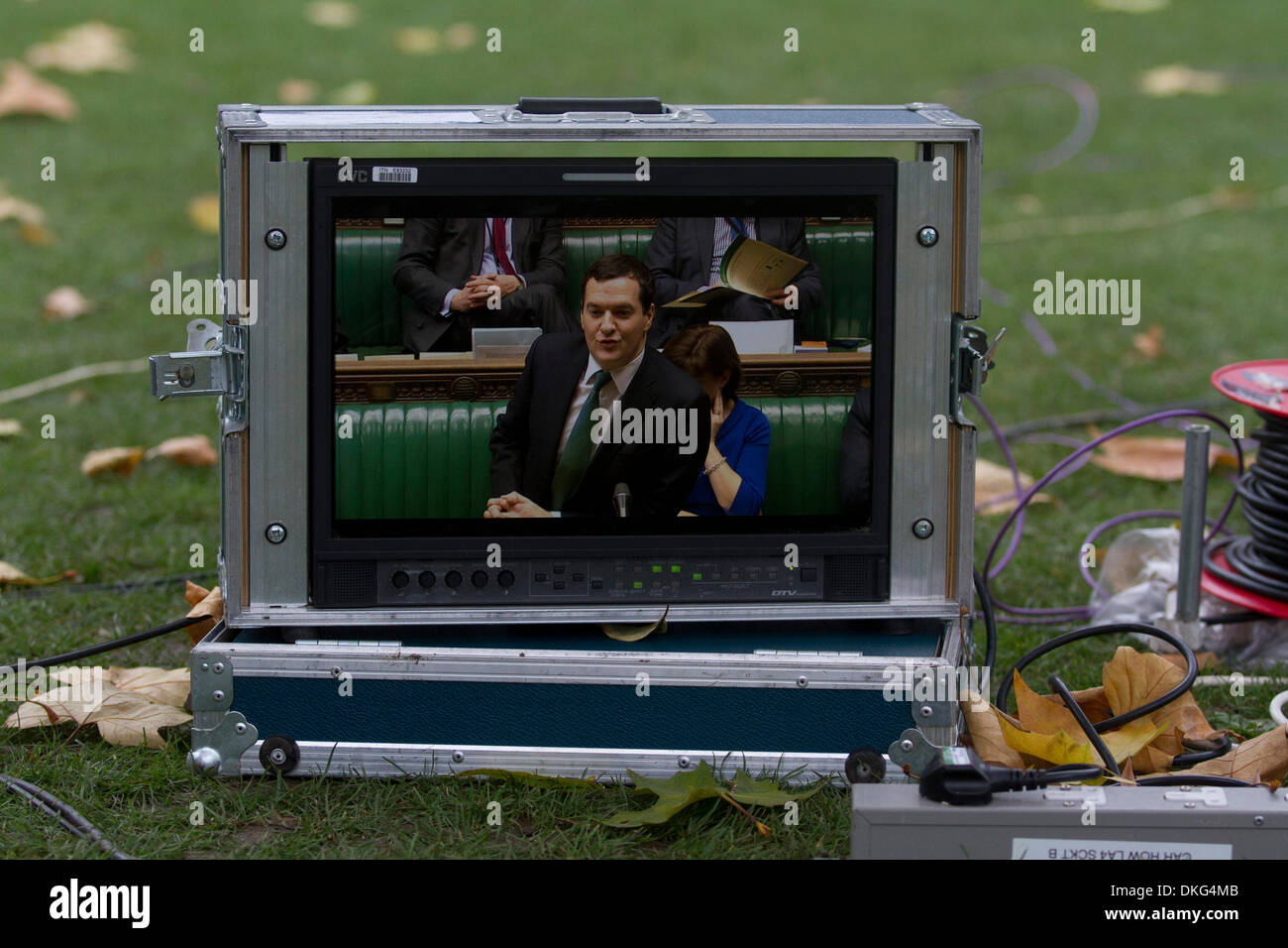 Westminster London,UK. 5th December 2013.  Chancellor of The Exchequer George Osborne  delivers his Autumn statement on the economy to the House of Commons. George Osborne announced a freeze in fuel duty,  help for young people seeking work and for small businesses and stated that the UK national debt was £18bn lower than previously in march Credit:  amer ghazzal/Alamy Live News Stock Photo