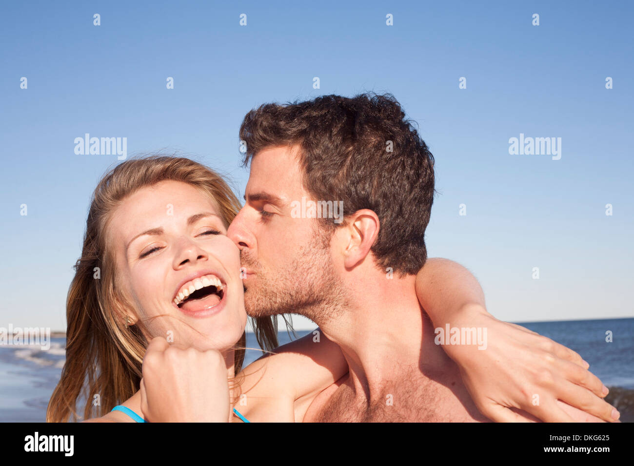 Close up portrait of couple on beach, Breezy Point, Queens, New York, USA Stock Photo