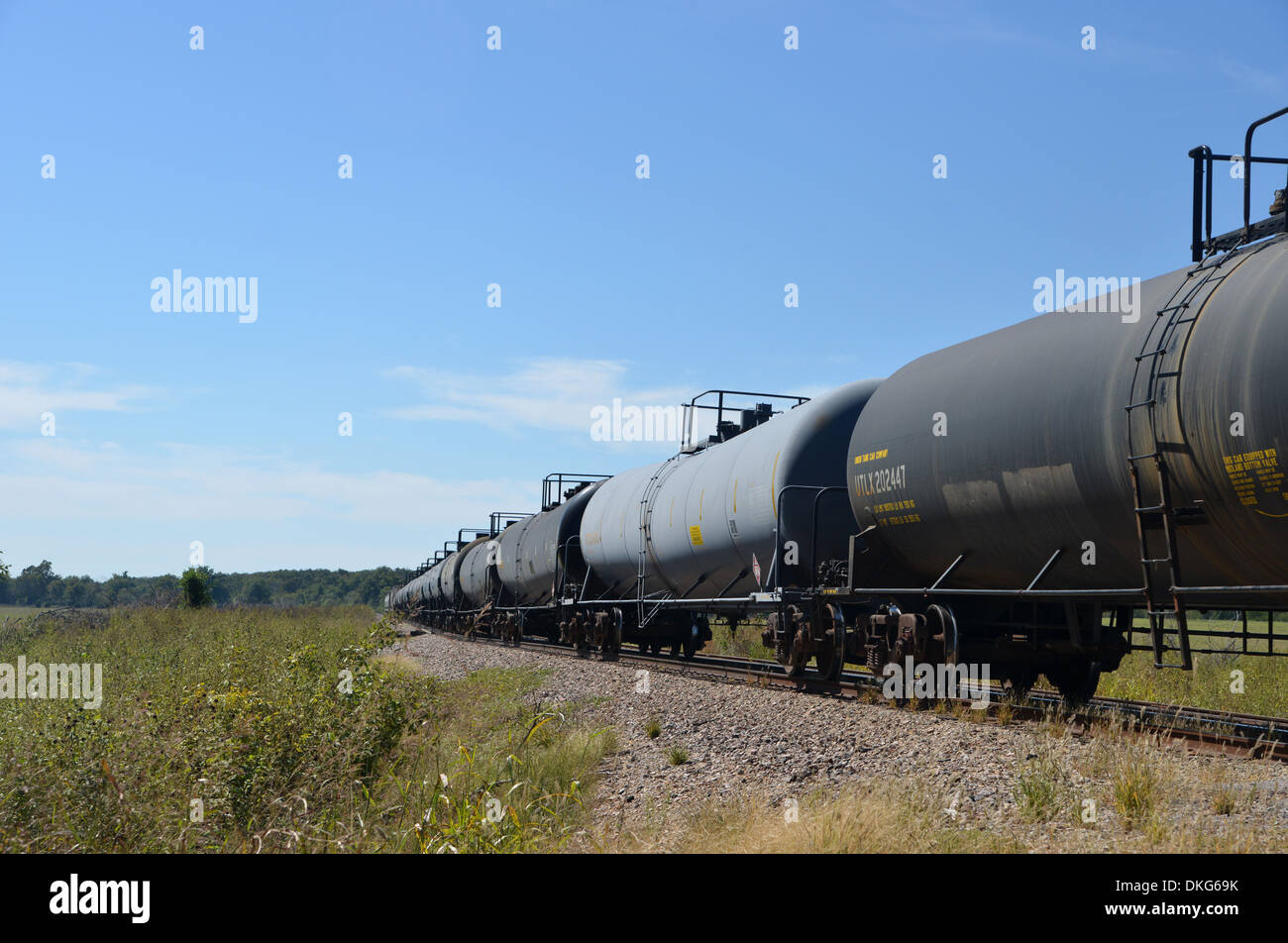 American tanker car train stretches away into the distance, Oklahoma on old Route 66 Rainbow Road Stock Photo