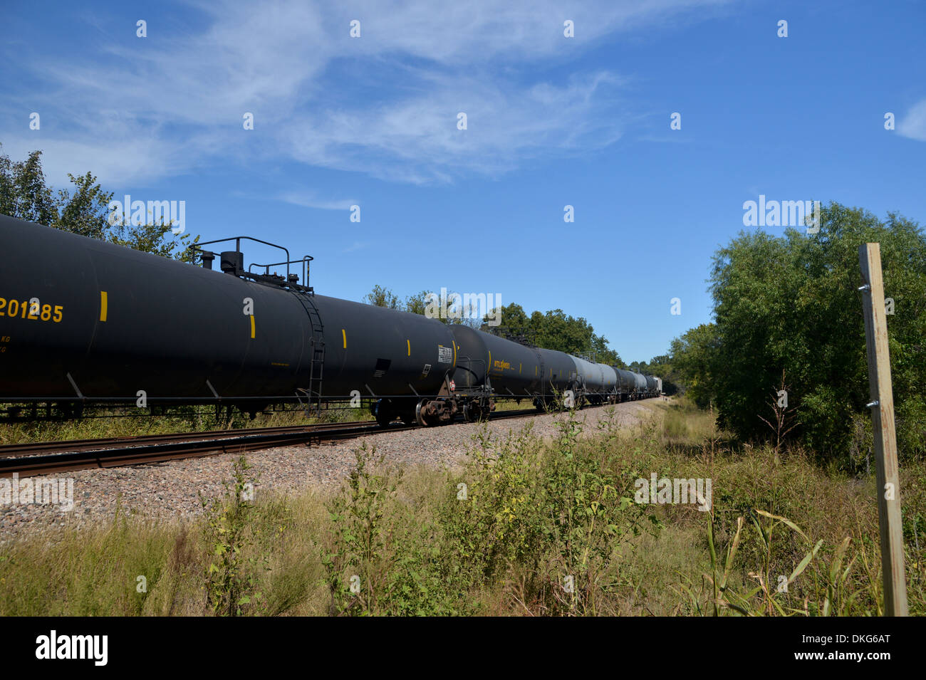 American tanker car train stretches away into the distance, Oklahoma on old Route 66 Rainbow Road Stock Photo
