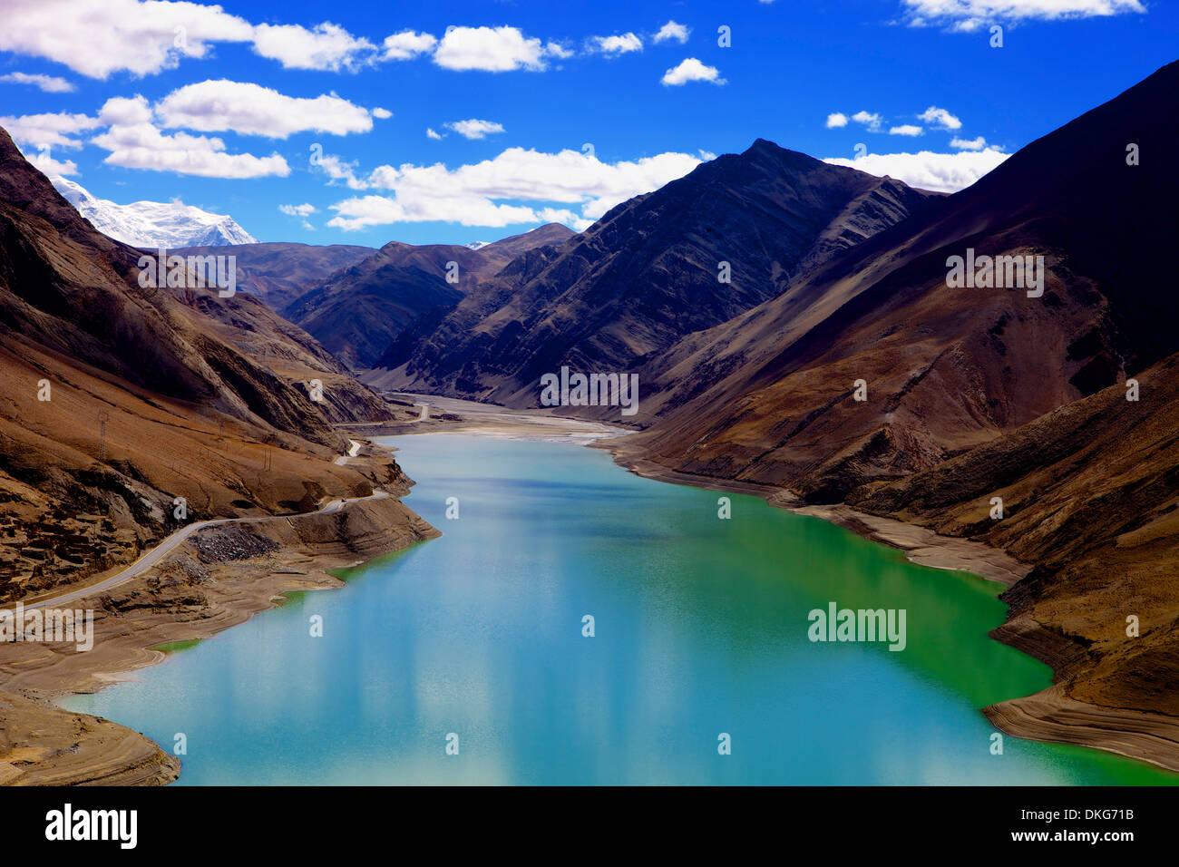Mountain range and artificial lake (reservoir) near the Karo-La Pass, beside the Friendship Highway, Tibet, China, Asia Stock Photo