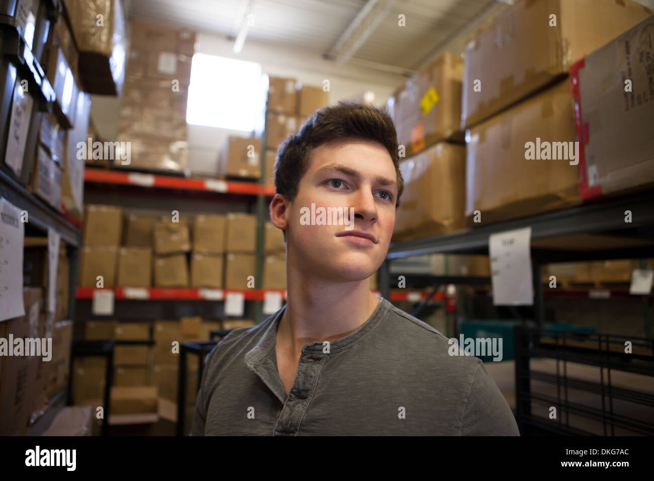 Worker standing in warehouse Stock Photo Alamy