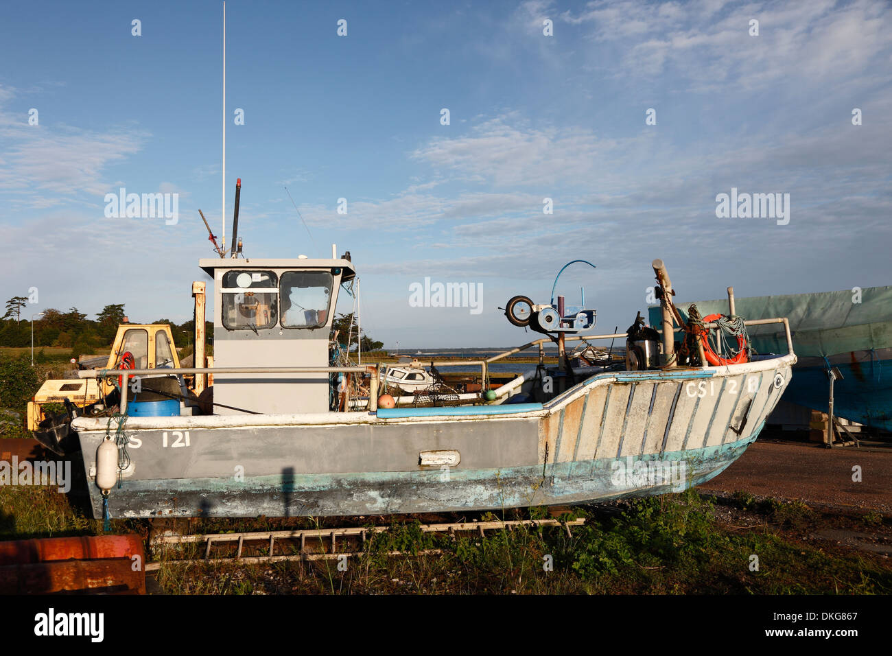 Small fishing boat on dry land in boatyard Yarmouth Isle of Wight Hampshire England Stock Photo