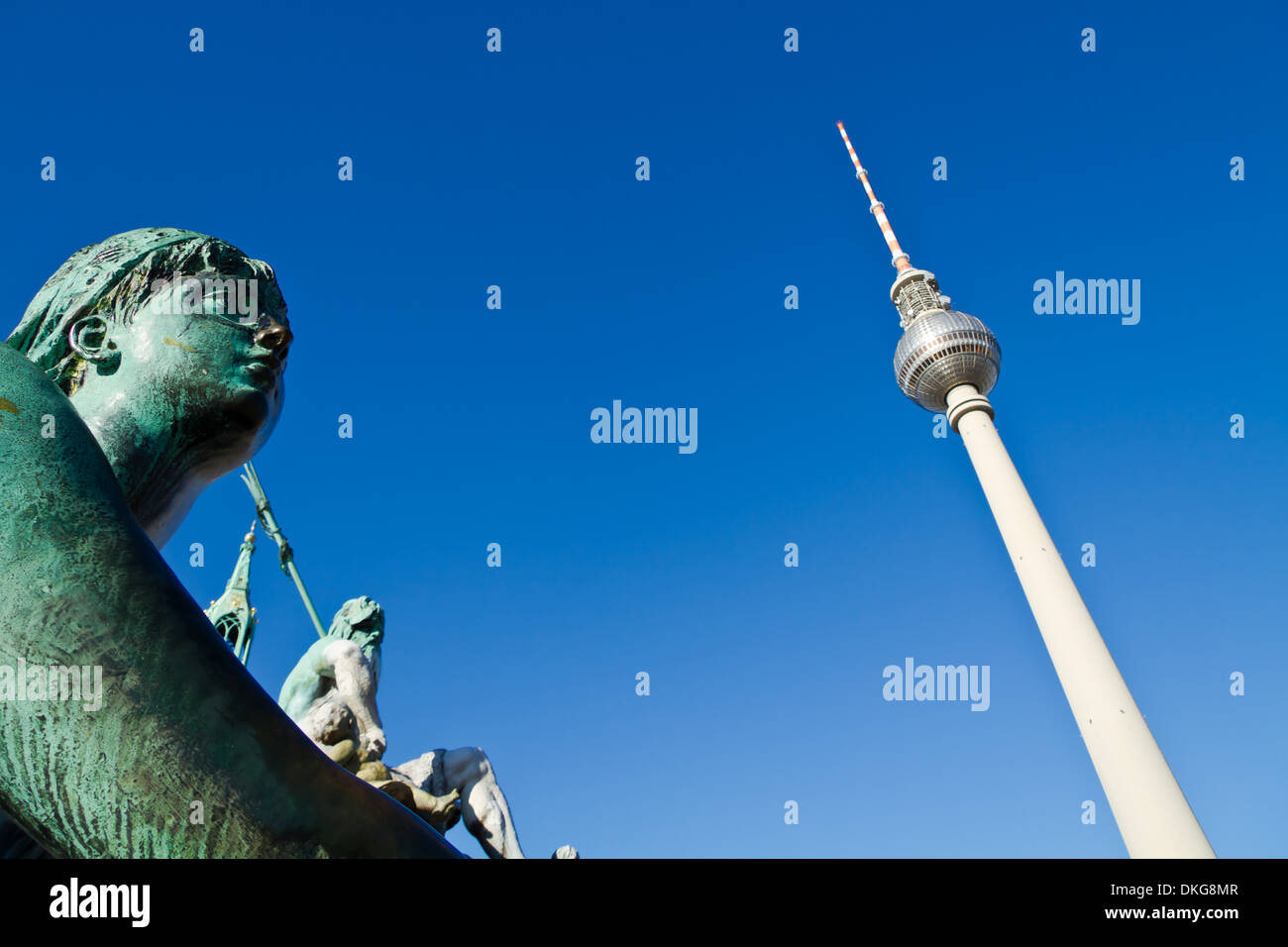 Statue of Neptune Fountain and television tower Alex, Germany, Europe Stock Photo