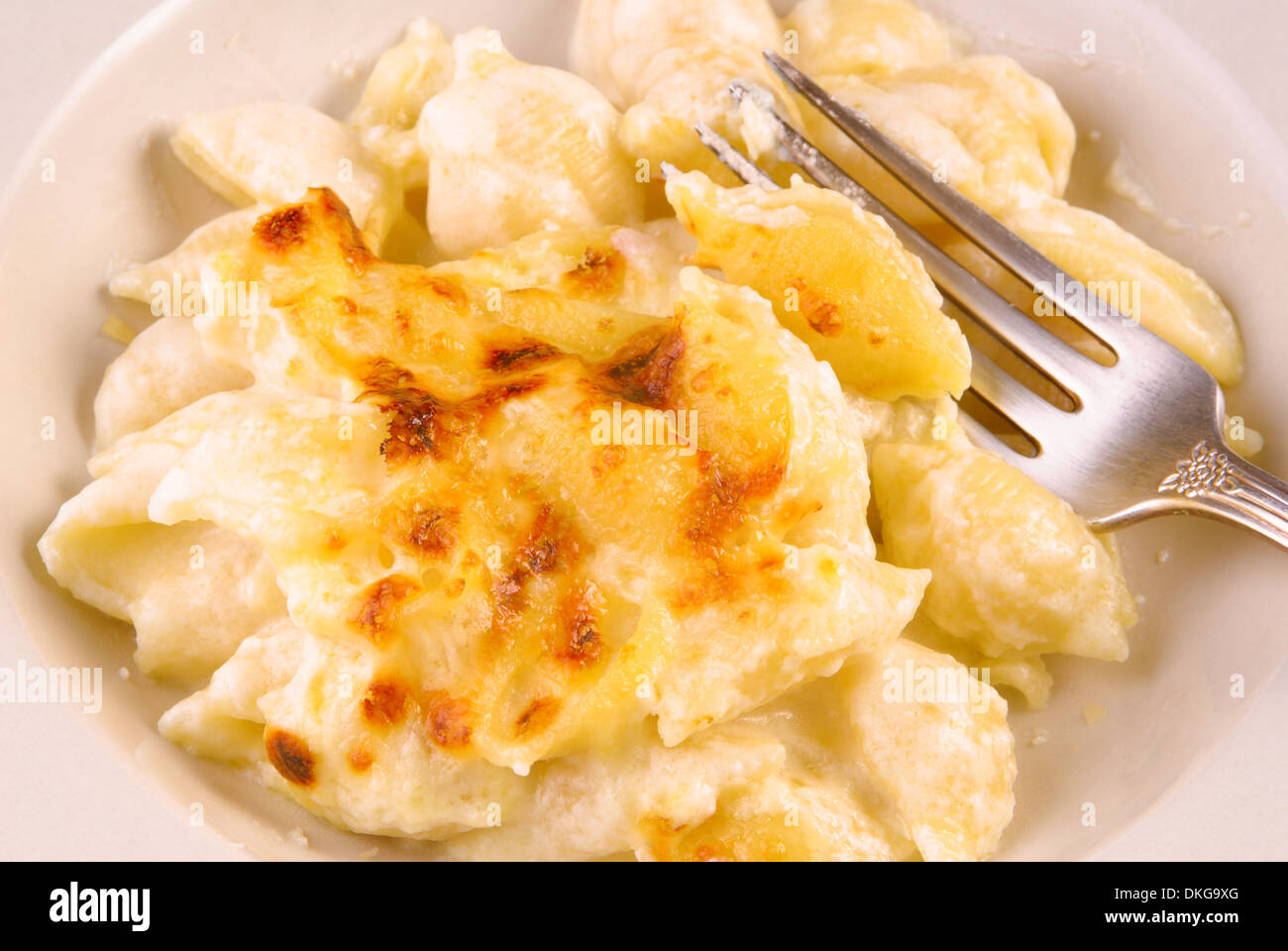 Baked Macaroni and Cheese with a fork Stock Photo