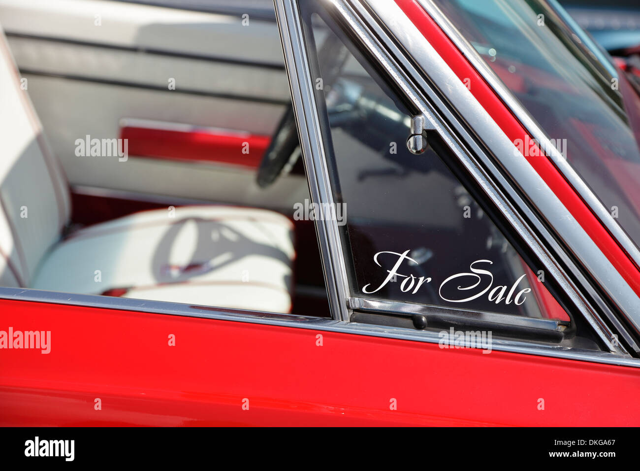 A 'for sale' decal on a vintage convertible at a classic car show, USA Stock Photo