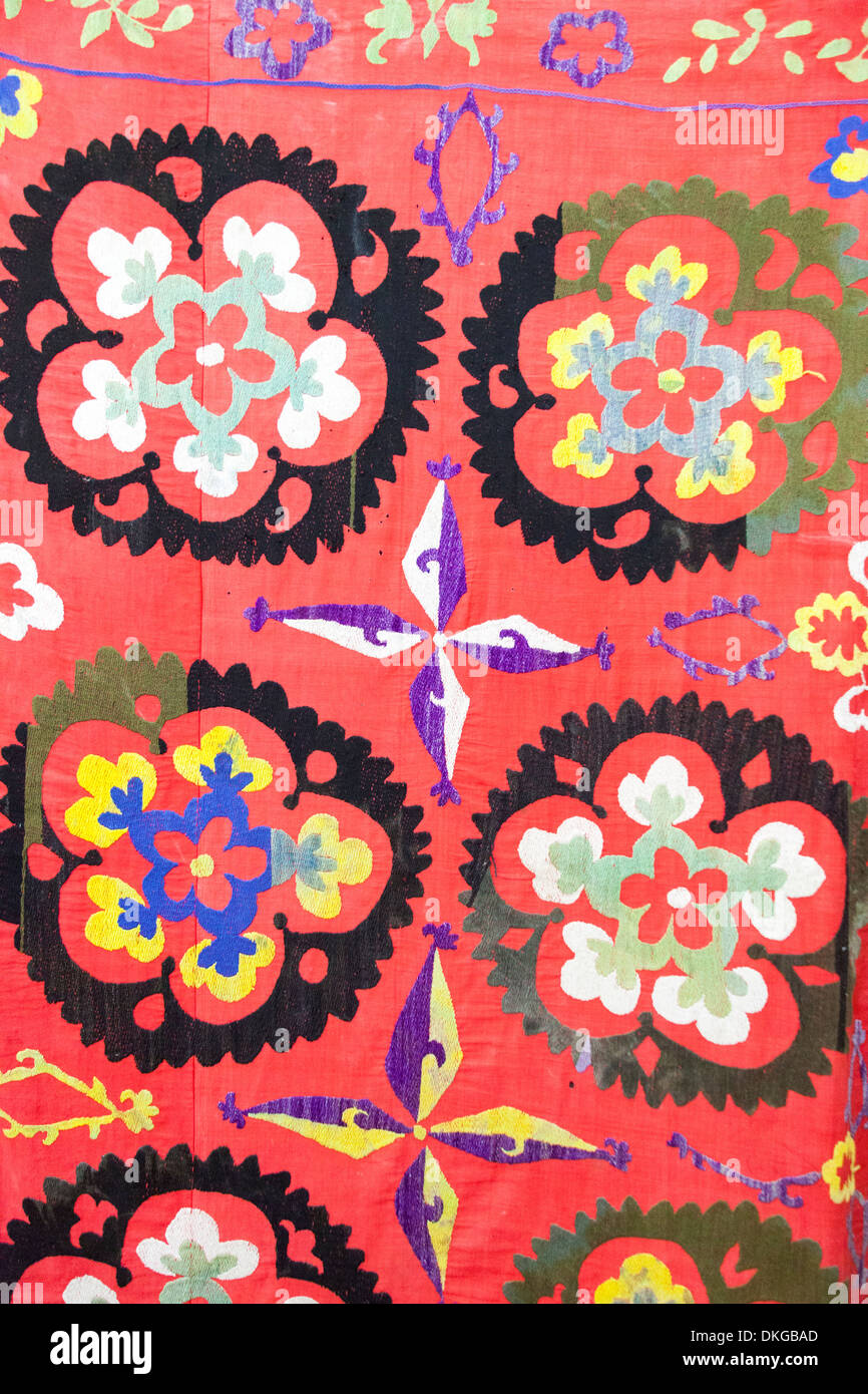 Colourful Suzani textile, cotton hand embroidered needlework, inside Museum of Applied Arts, Khiva, Uzbekistan Stock Photo