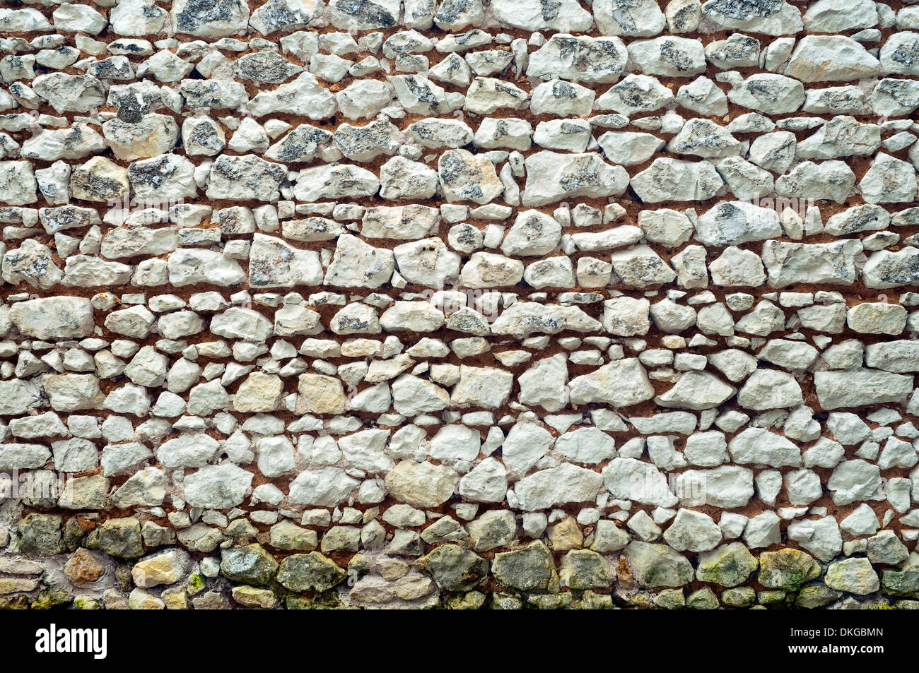 Old stone wall with random courses - France. Stock Photo