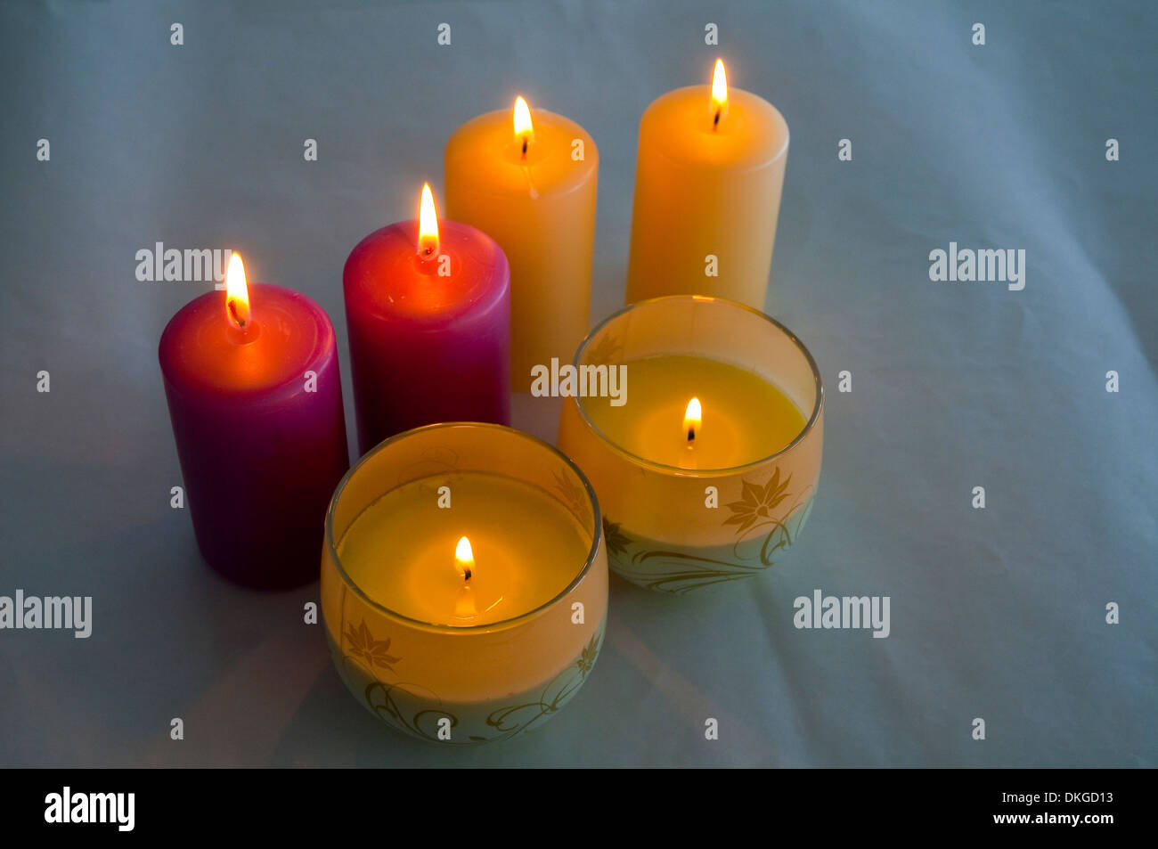Six lit up candles. Stock Photo
