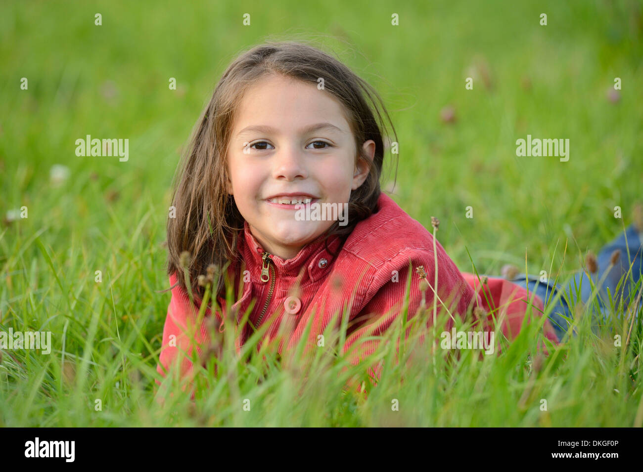 Girl lying in a meadow Stock Photo