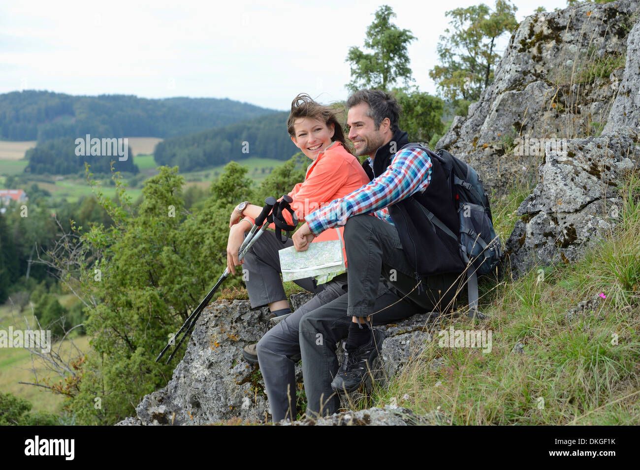 Couple taking a rest from their hiking tour Stock Photo