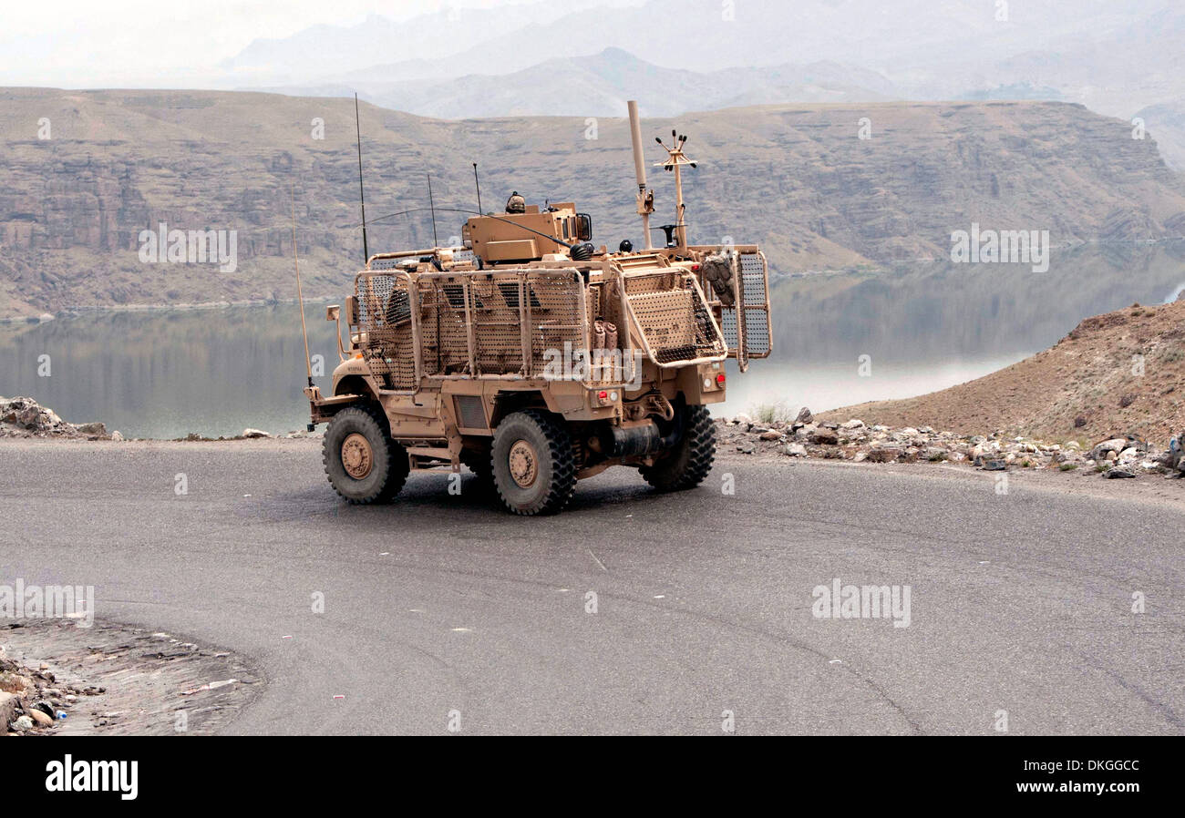 A US Army mine-resistant, ambush-protected vehicle travels on a main supply route during a logistics operation May 15, 2013 in Kapisa province, Afghanistan. Stock Photo