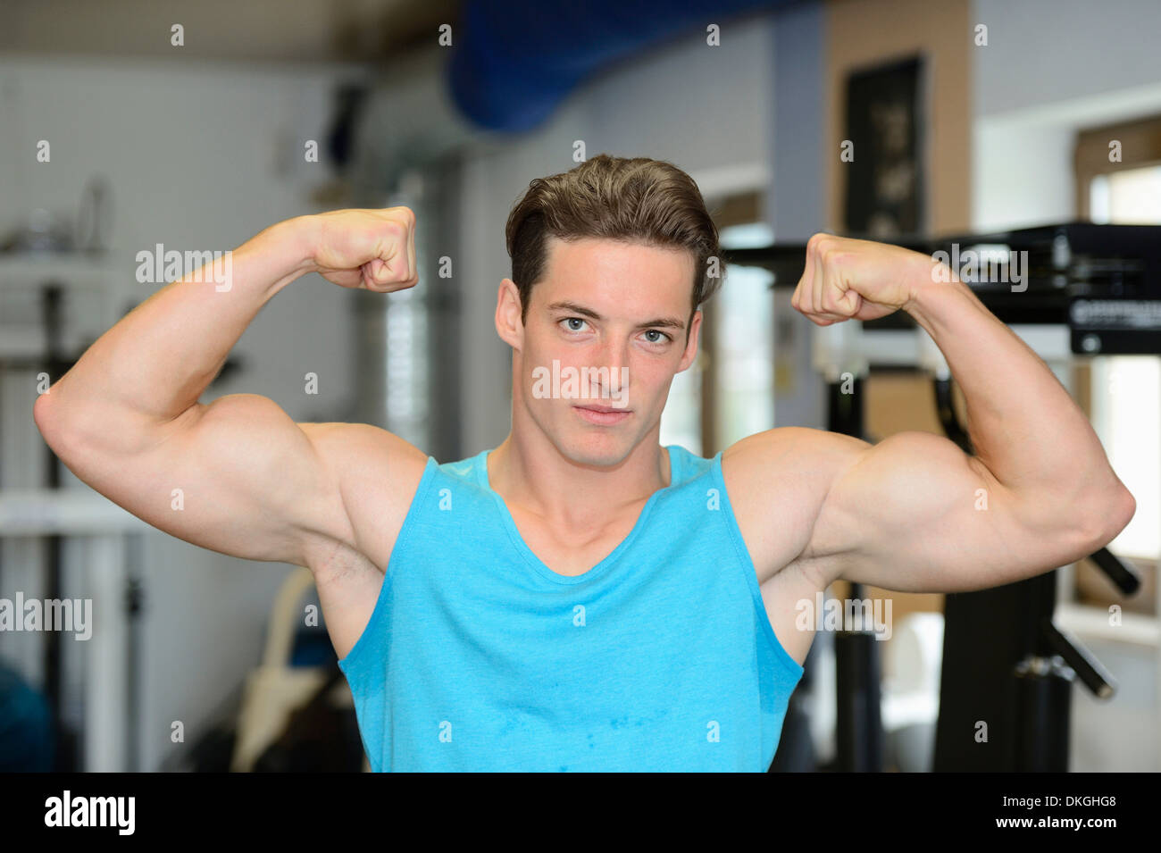 Man in tank top flexing hi-res stock photography and images - Alamy